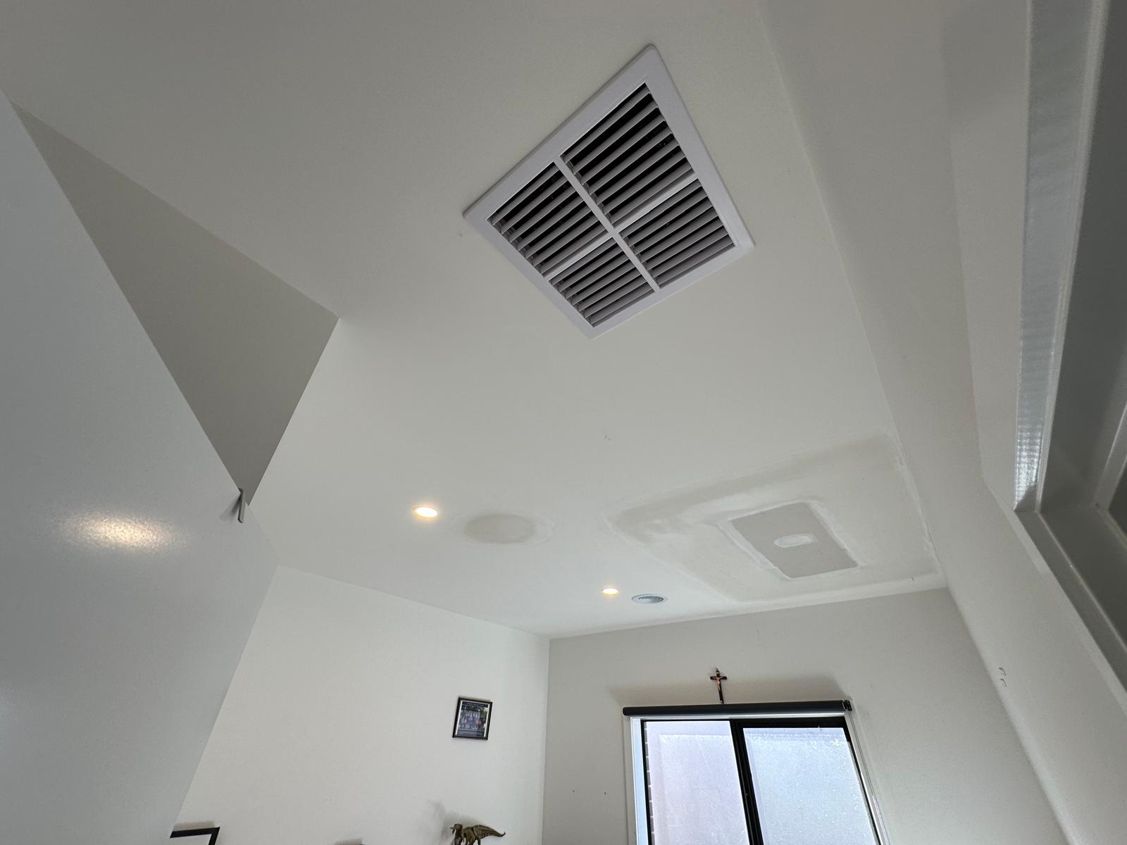 Seamless drywall patch repair expertly blended for a smooth and flawless ceiling finish.